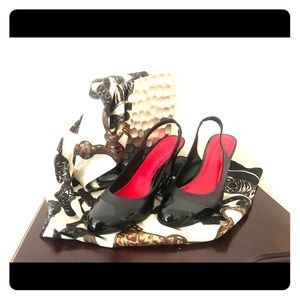 Leather sling back with patent leather toe & heel.